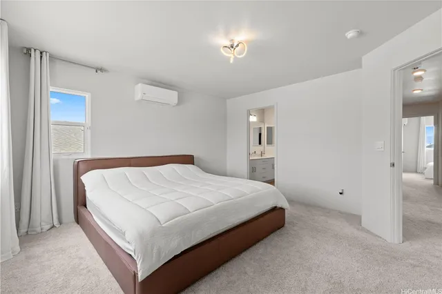 a bedroom with a bed and a lamp