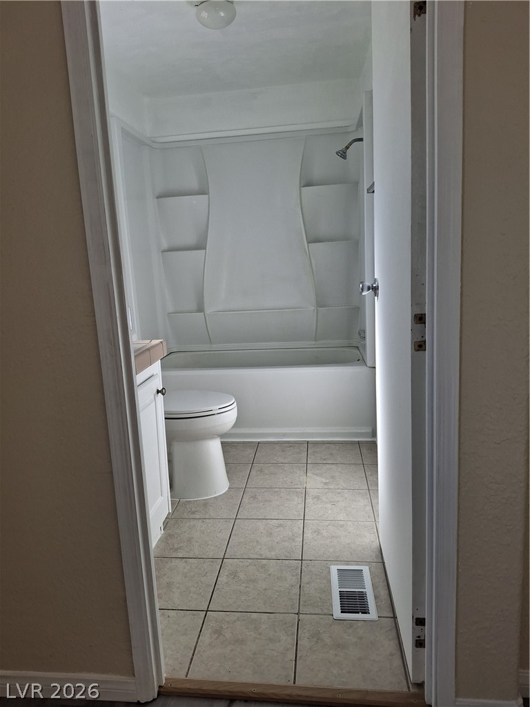 4550 Horn Road Pahrump, NV 89048 - Photo 8 of 12 This clean bathroom showcases a pristine shower and well-maintained tile work.