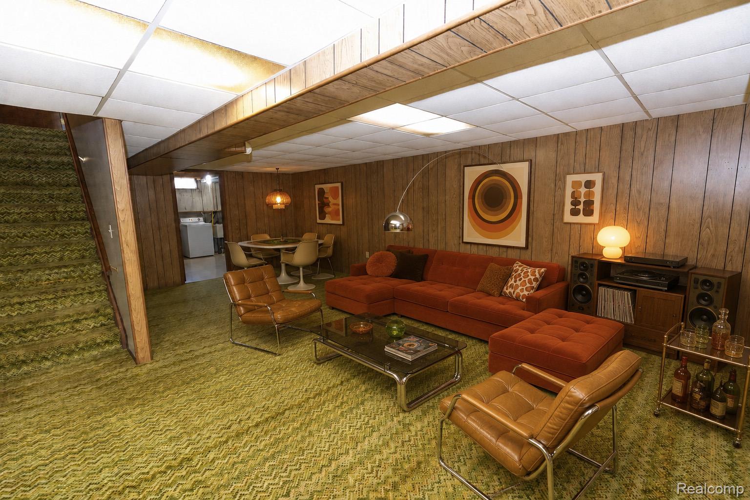125 Cuttle Road Marysville, MI 48040 - Photo 32 of 44 Wood-paneled walls with drop ceiling panels and recessed lighting, staircase with patterned carpet, and a separate dining area