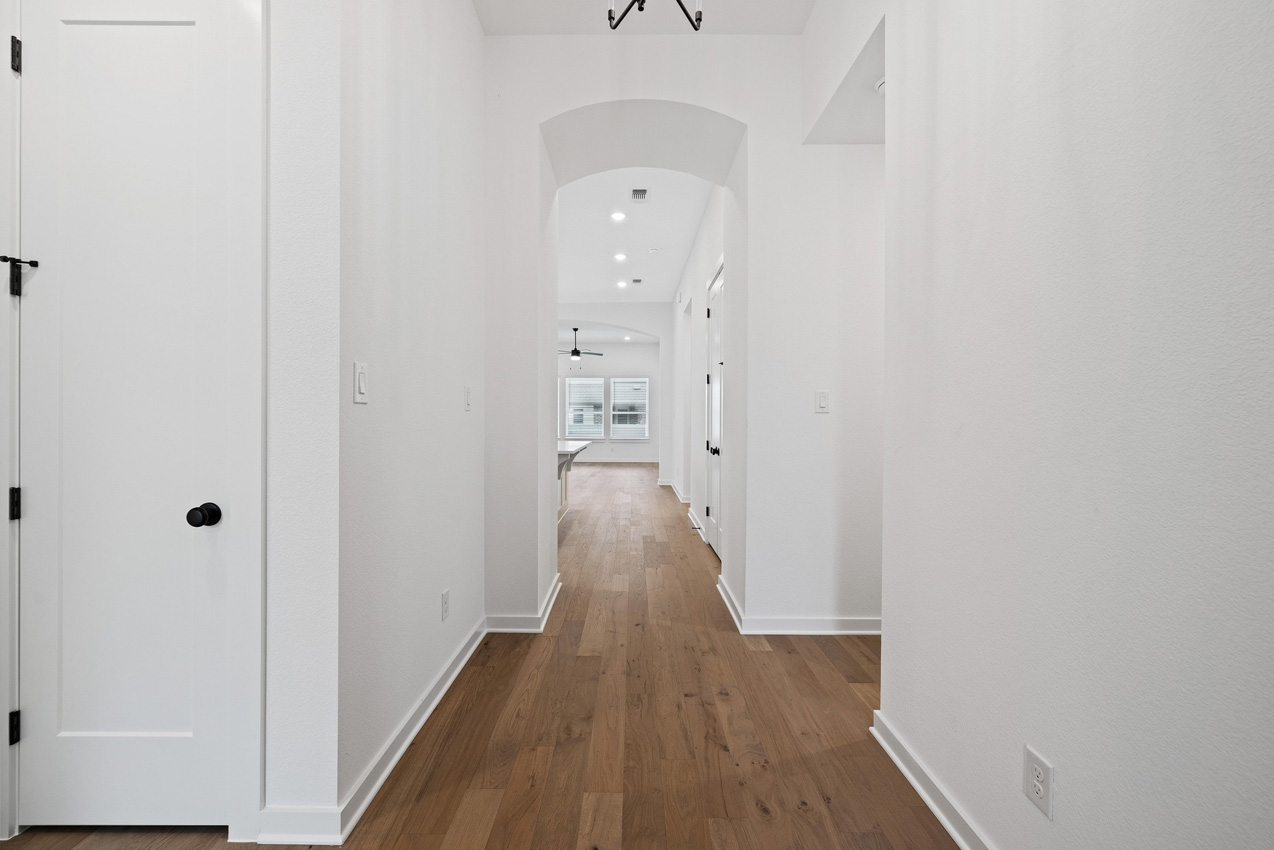 120 Fox Run Georgetown, TX 78628 - Photo 12 of 30 a view of a hallway with wooden floor