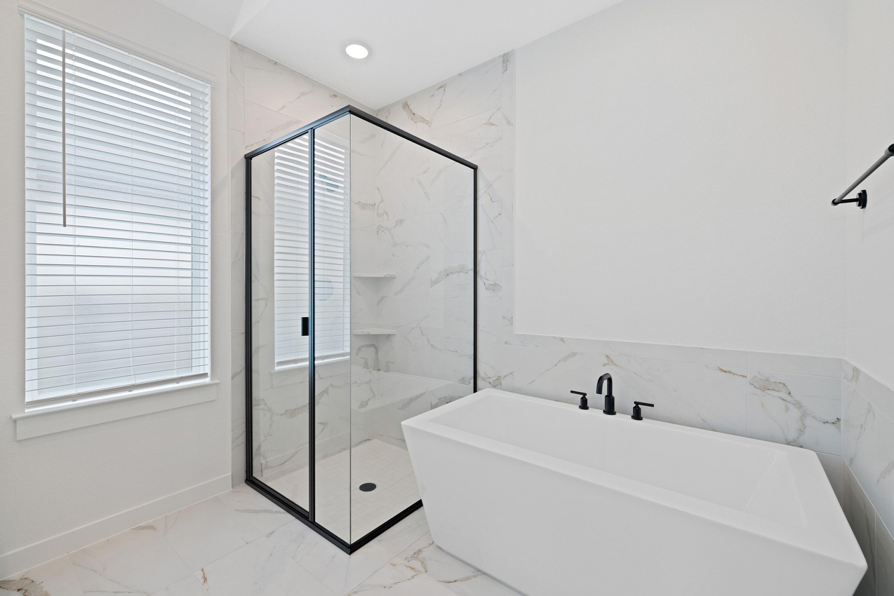 120 Fox Run Georgetown, TX 78628 - Photo 9 of 30 a bathroom with a tub and shower