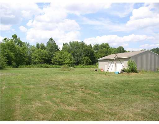 597 Soap Run Road Fombell, PA 16123 - Photo 2 of 6 Parking Lot/Garage. Detached garage is 30x42 ft. with electrical outlets every 8 ft. Both vehicle doors are the tall ones.