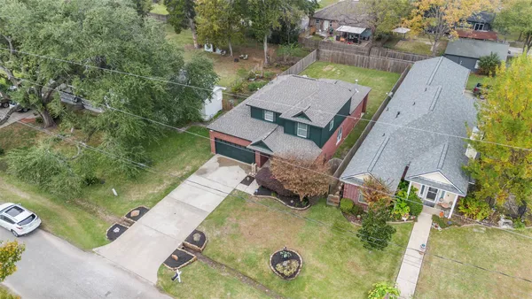 an aerial view of a house with outdoor space