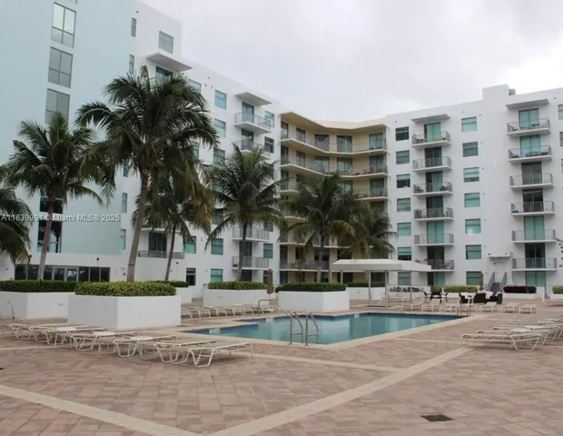 a view of swimming pool with a outdoor seating