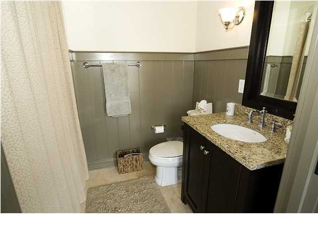 34 The Lofts In Barrett Square, Unit 2E Rosemary Beach, FL 32461 - Photo 10 of 12 a bathroom with a granite countertop sink toilet and shower