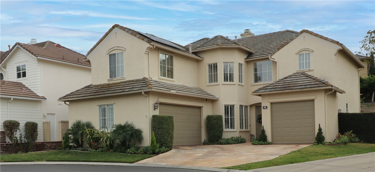 48 Creek View Road Trabuco Canyon, CA 92679 - Photo 8 of 10 a view of a white house with a small yard and plants