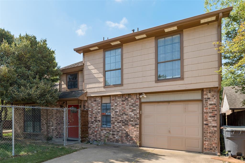 a front view of a house with garage
