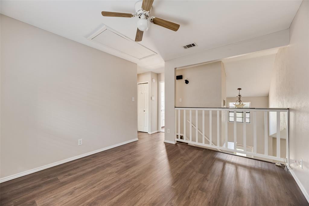 11136 McCree Road Dallas, TX 75238 - Photo 16 of 21 a view of a hallway with wooden floor