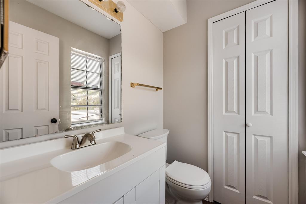 11136 McCree Road Dallas, TX 75238 - Photo 18 of 21 a bathroom with a sink a toilet and shower