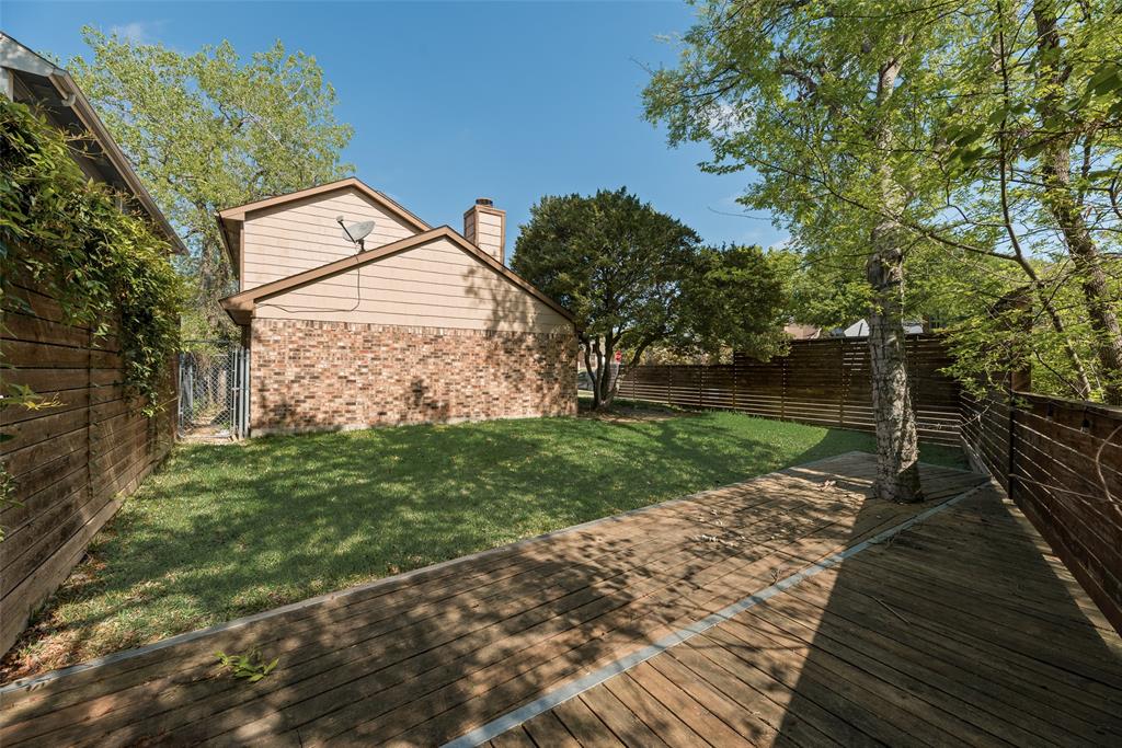 11136 McCree Road Dallas, TX 75238 - Photo 20 of 21 a backyard of a house with lots of green space