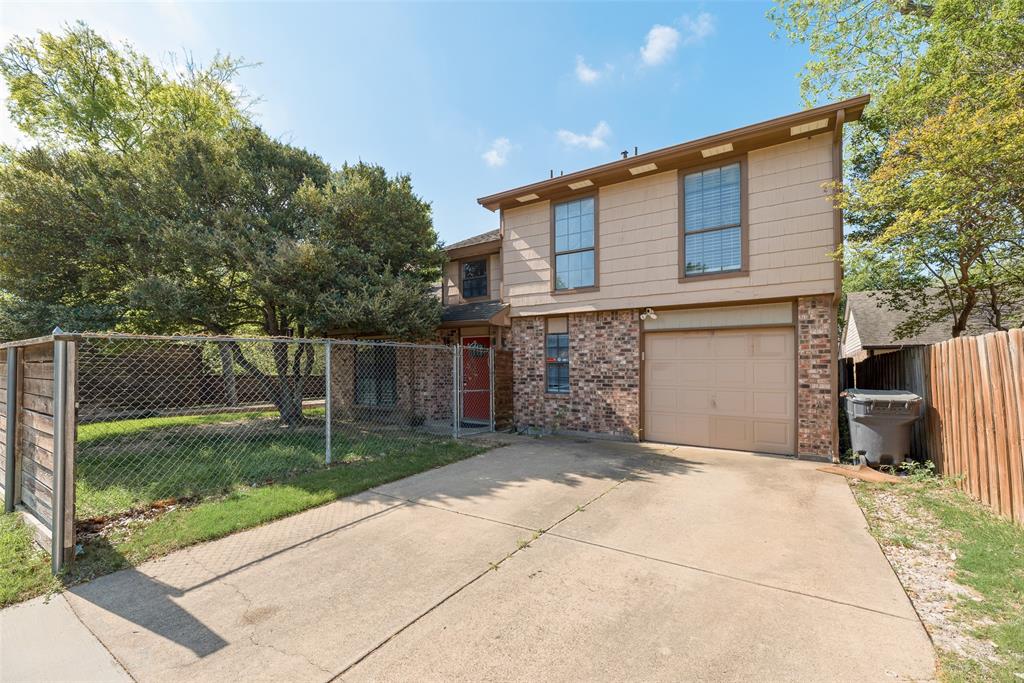 11136 McCree Road Dallas, TX 75238 - Photo 21 of 21 a front view of a house with garden