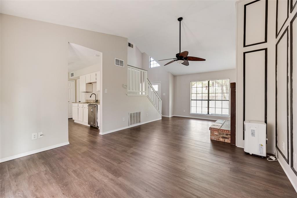 11136 McCree Road Dallas, TX 75238 - Photo 6 of 21 a view of empty room with wooden floor and window