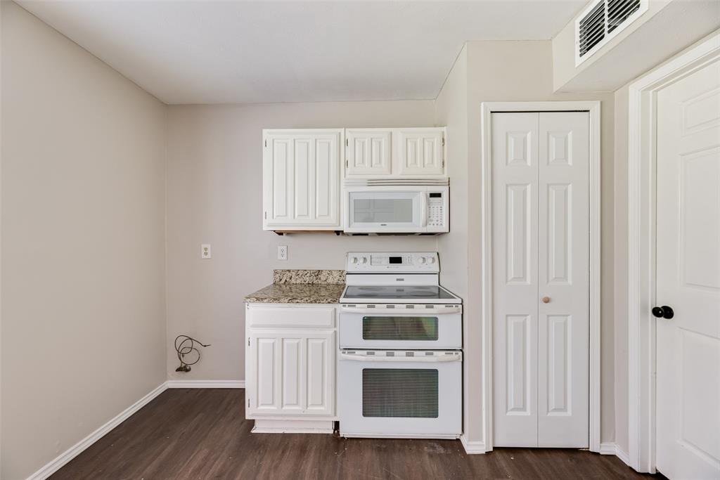 11136 McCree Road Dallas, TX 75238 - Photo 9 of 21 a kitchen with a stove and a microwave