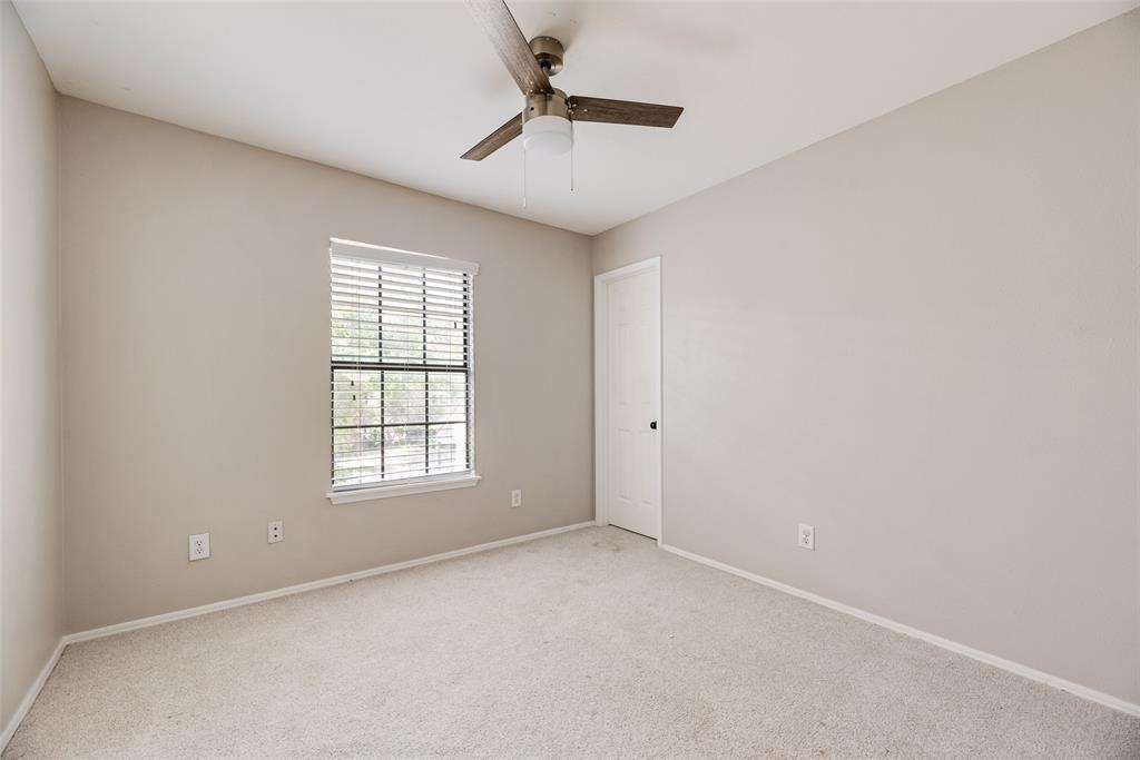 11136 McCree Road Dallas, TX 75238 - Photo 10 of 21 an empty room with windows and fan