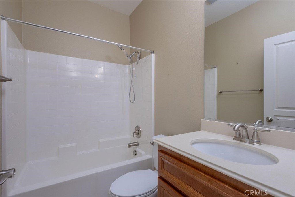 7692 Dutra Drive Hemet, CA 92545 - Photo 13 of 48 a bathroom with a granite countertop sink toilet and shower