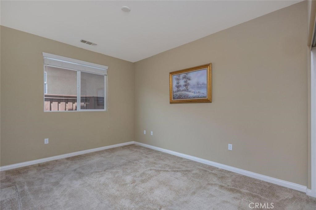 7692 Dutra Drive Hemet, CA 92545 - Photo 14 of 48 a view of an empty room with a window