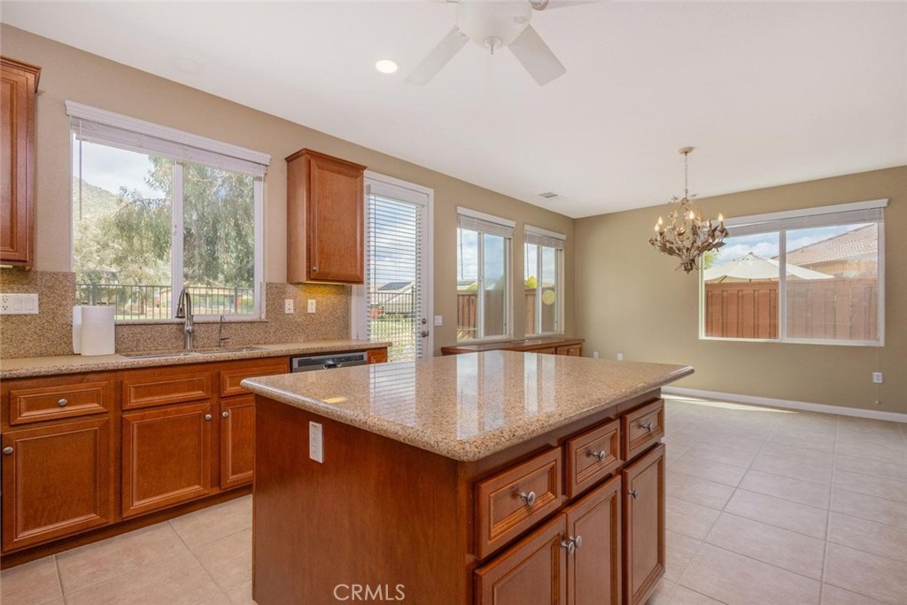 7692 Dutra Drive Hemet, CA 92545 - Photo 18 of 48 a kitchen with stainless steel appliances granite countertop a sink stove and refrigerator