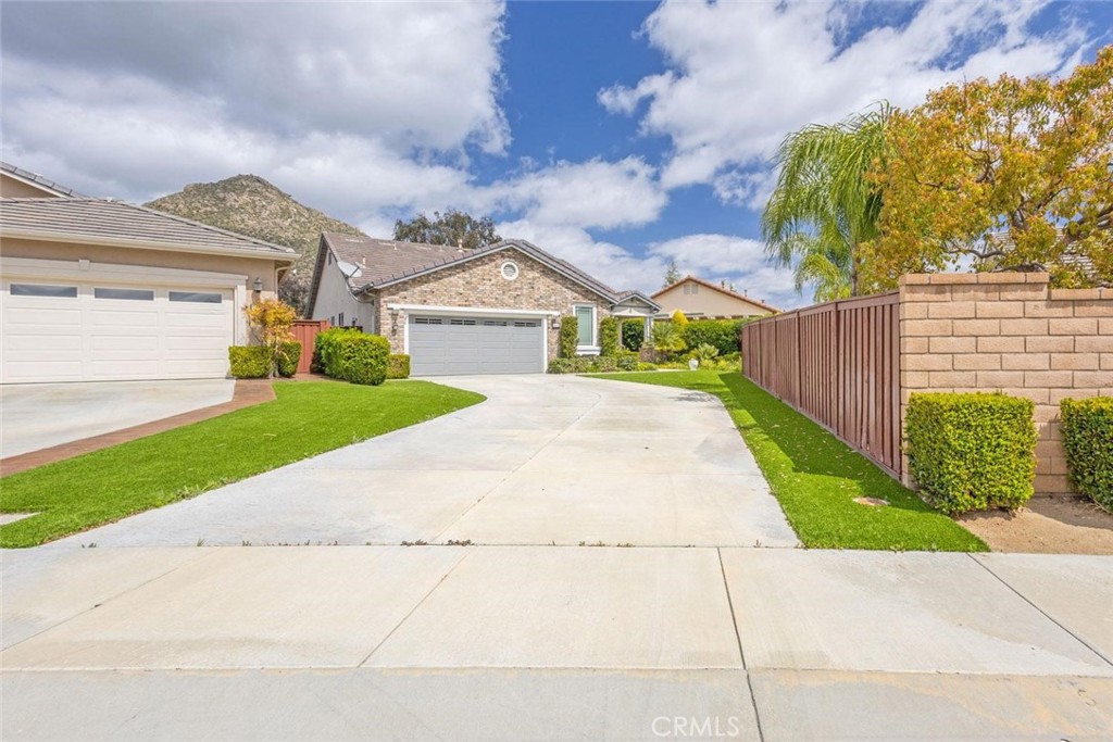 7692 Dutra Drive Hemet, CA 92545 - Photo 2 of 48 a view of a house with a yard and plants