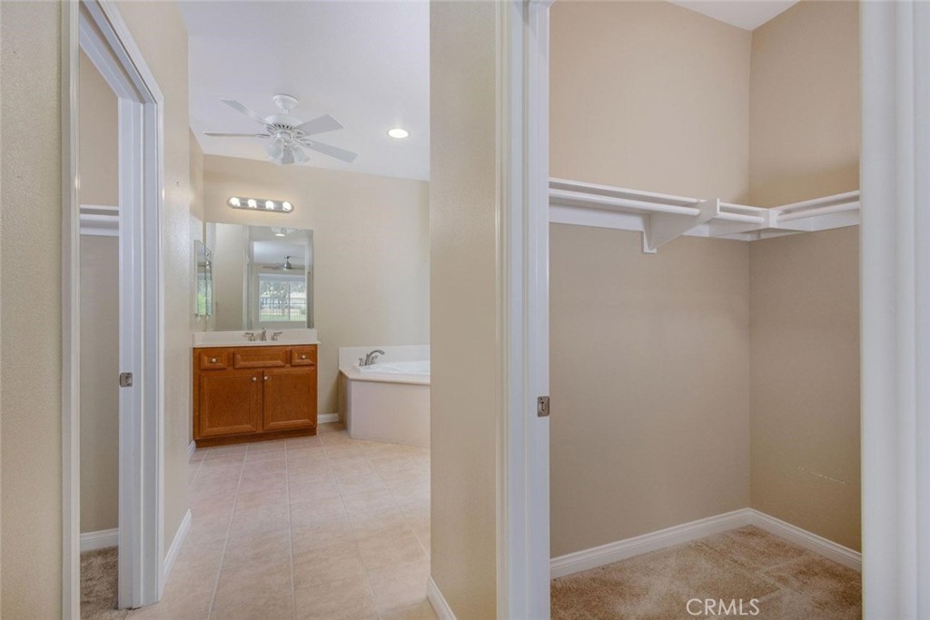 7692 Dutra Drive Hemet, CA 92545 - Photo 24 of 48 a bathroom with a tub shower and sink