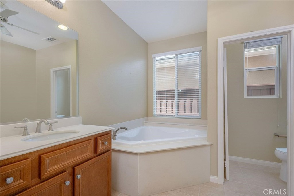 7692 Dutra Drive Hemet, CA 92545 - Photo 25 of 48 a bathroom with a sink a toilet and shower