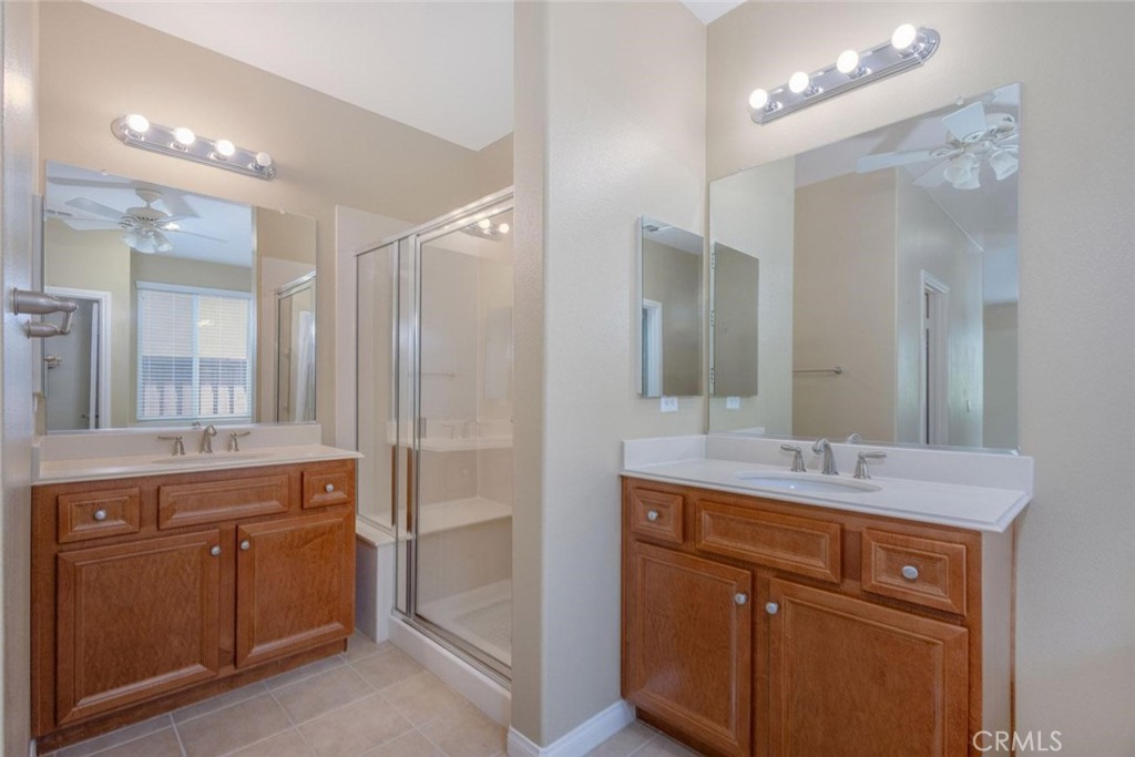 7692 Dutra Drive Hemet, CA 92545 - Photo 26 of 48 a bathroom with a granite countertop sink mirror and double