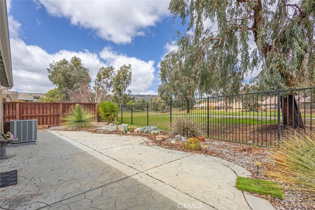 7692 Dutra Drive Hemet, CA 92545 - Photo 29 of 48 a view of a backyard with wooden fence