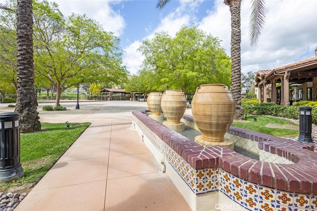 7692 Dutra Drive Hemet, CA 92545 - Photo 39 of 48 a swimming pool with outdoor seating and garden