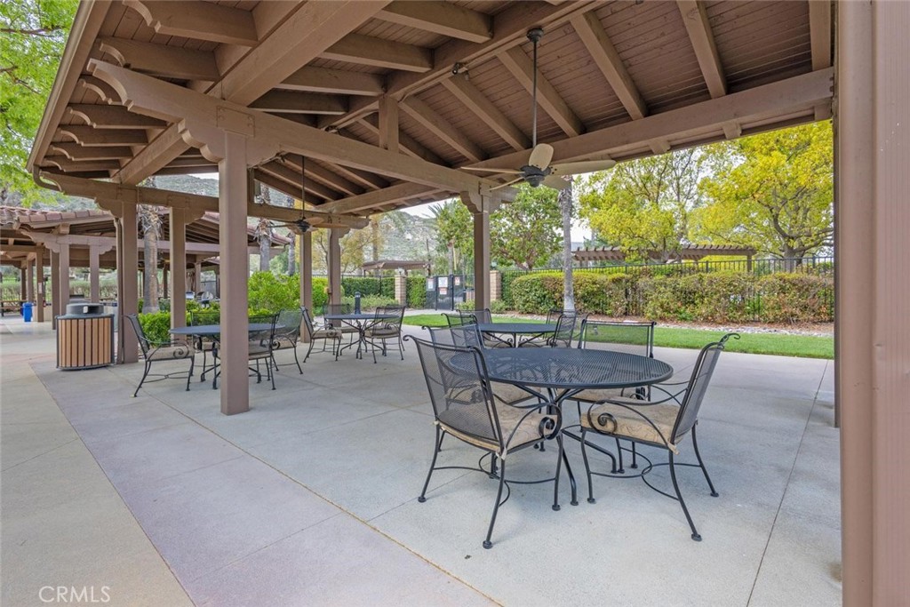 7692 Dutra Drive Hemet, CA 92545 - Photo 42 of 48 a patio with a patio table and chairs