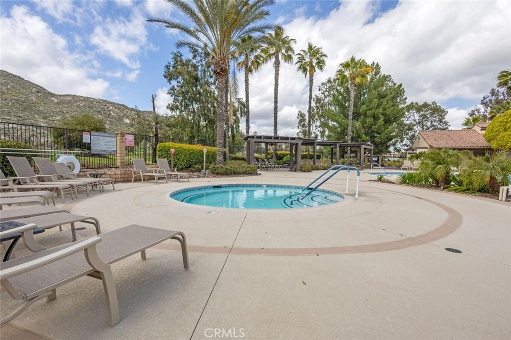 7692 Dutra Drive Hemet, CA 92545 - Photo 44 of 48 a swimming pool with outdoor seating and city view