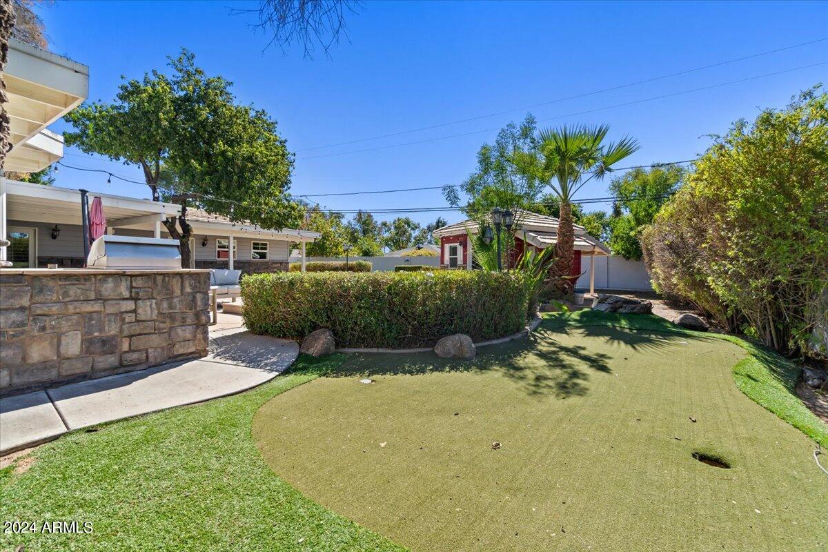 3841 East Elm Street Phoenix, AZ 85018 - Photo 57 of 72 a view of a backyard with plants and a patio