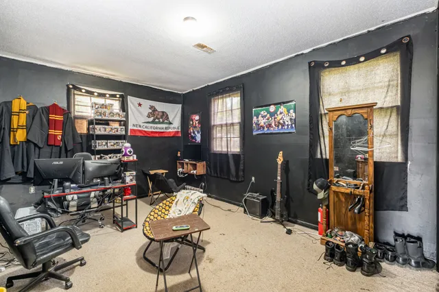 a room with gym equipment and a large window