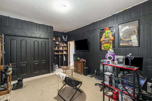 a room with furniture and a flat screen tv