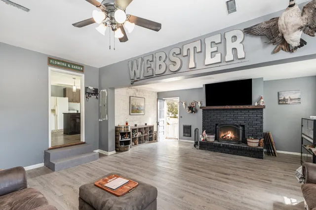 a living room with furniture and a fireplace