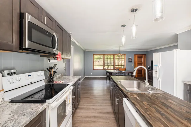a kitchen that has a lot of cabinets in it