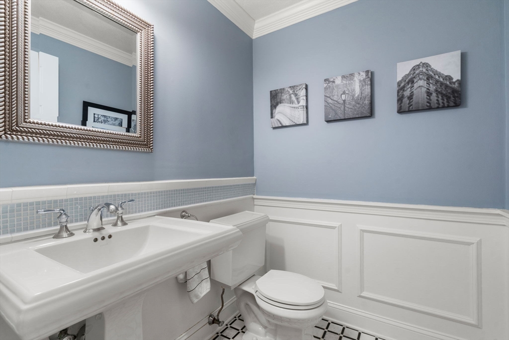 22 Fox Run Road Sudbury, MA 01776 - Photo 16 of 42 a bathroom with a toilet a sink and mirror