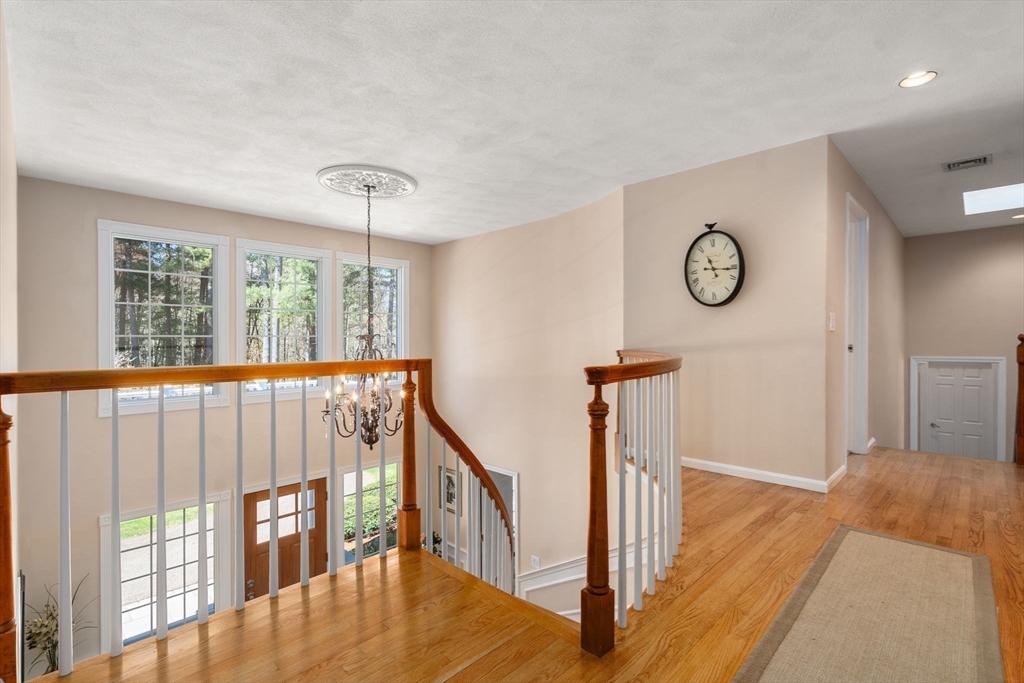 22 Fox Run Road Sudbury, MA 01776 - Photo 17 of 42 a view of a hallway with wooden floor and front door