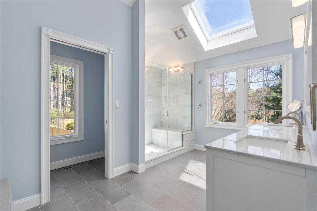 22 Fox Run Road Sudbury, MA 01776 - Photo 20 of 42 a spacious bathroom with a sink mirror and a bathtub