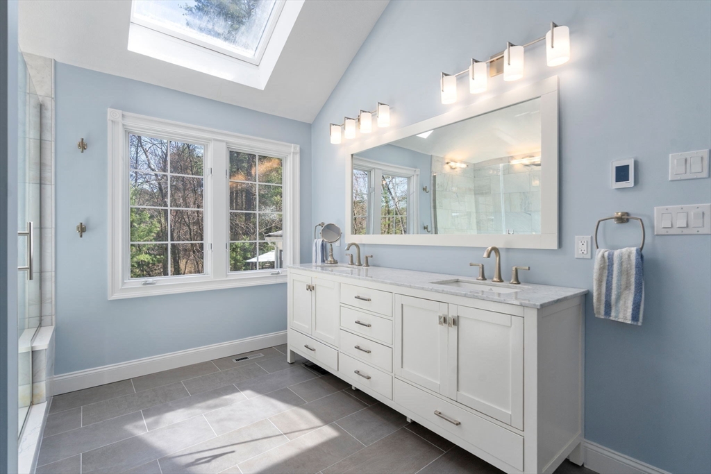 22 Fox Run Road Sudbury, MA 01776 - Photo 21 of 42 a bathroom with a double vanity sink a mirror and next to a window