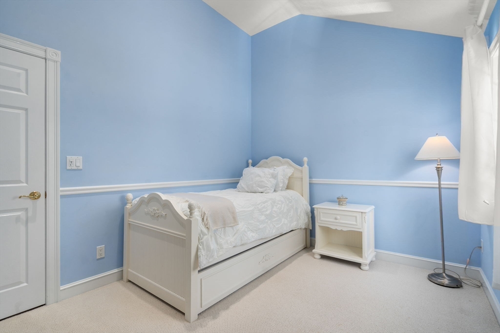 22 Fox Run Road Sudbury, MA 01776 - Photo 25 of 42 a bedroom with a bed and a lamp
