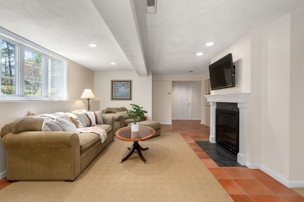 22 Fox Run Road Sudbury, MA 01776 - Photo 28 of 42 a living room with furniture and a fireplace