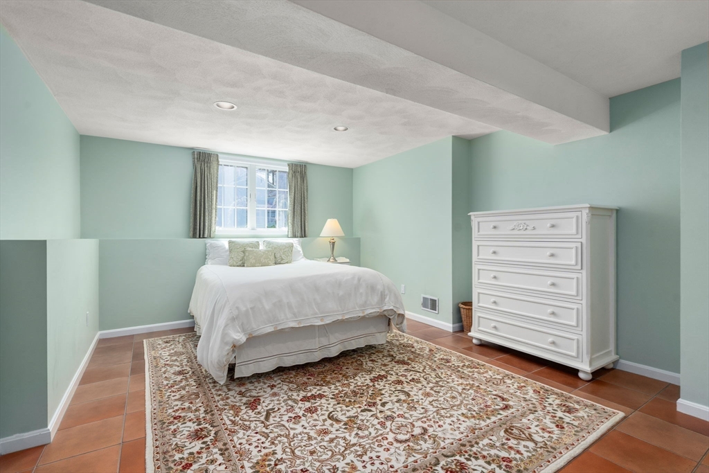 22 Fox Run Road Sudbury, MA 01776 - Photo 31 of 42 a bedroom with a bed and a dresser