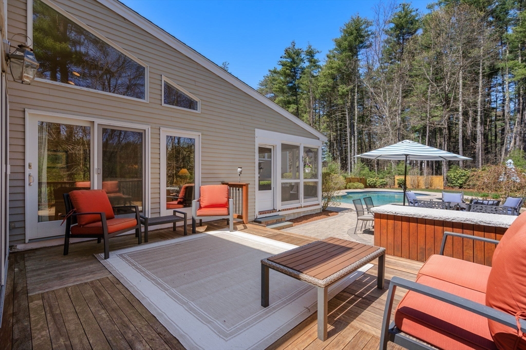 22 Fox Run Road Sudbury, MA 01776 - Photo 34 of 42 a backyard of a house with barbeque oven table and chairs