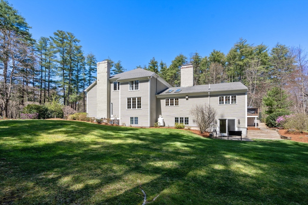 22 Fox Run Road Sudbury, MA 01776 - Photo 40 of 42 a front view of a house with a yard