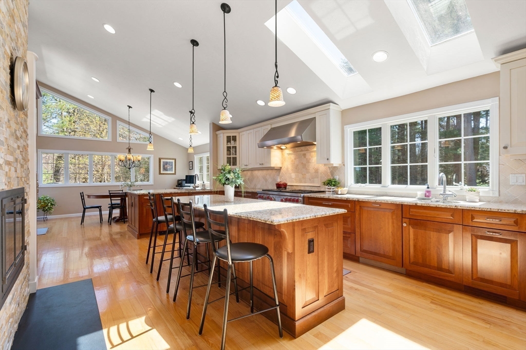 22 Fox Run Road Sudbury, MA 01776 - Photo 7 of 42 a kitchen with stainless steel appliances granite countertop table chairs and a large window