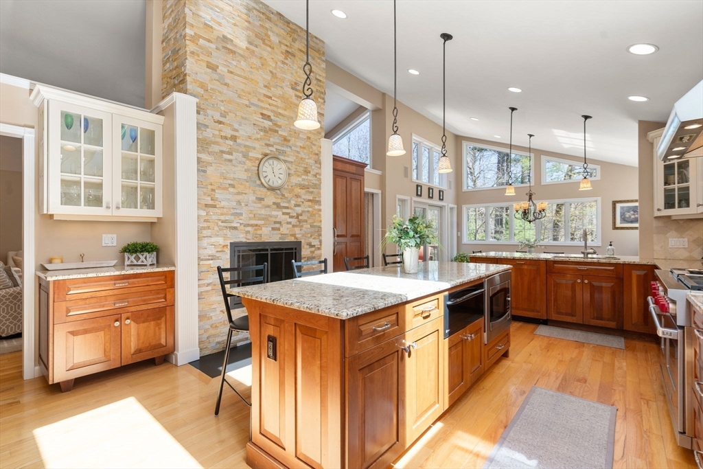 22 Fox Run Road Sudbury, MA 01776 - Photo 9 of 42 a kitchen with stainless steel appliances granite countertop a stove a sink and a refrigerator