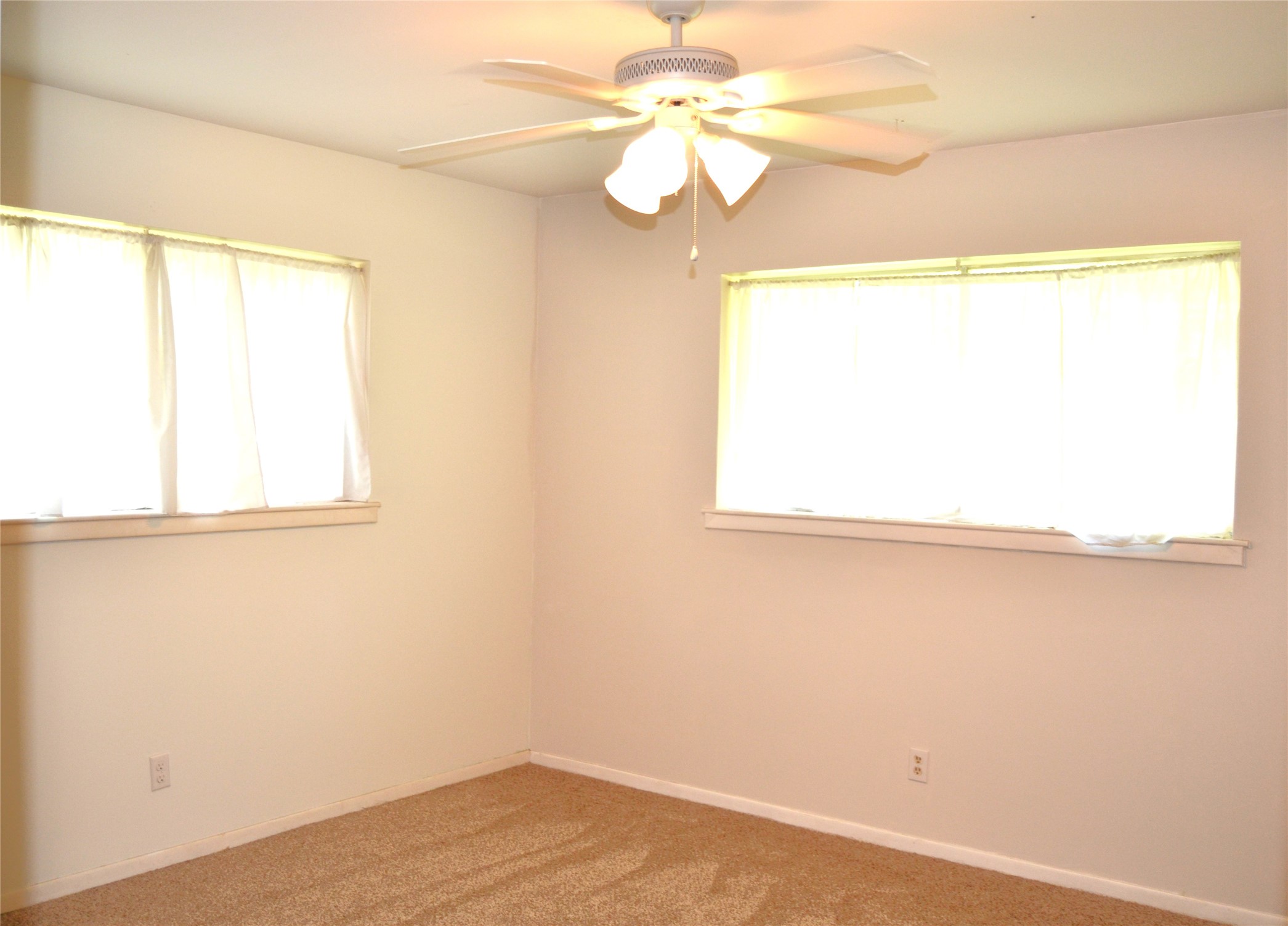 101 Summit Drive Conroe, TX 77303 - Photo 12 of 24 a view of a room with a window and wooden floor