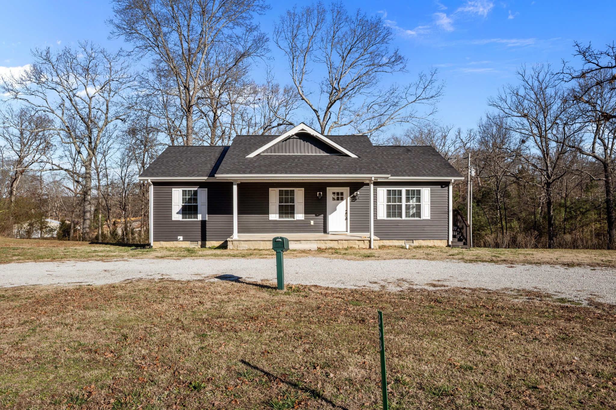 358 Able Street Big Sandy, TN 38221 - Photo 1 of 31 a front view of a house with a yard