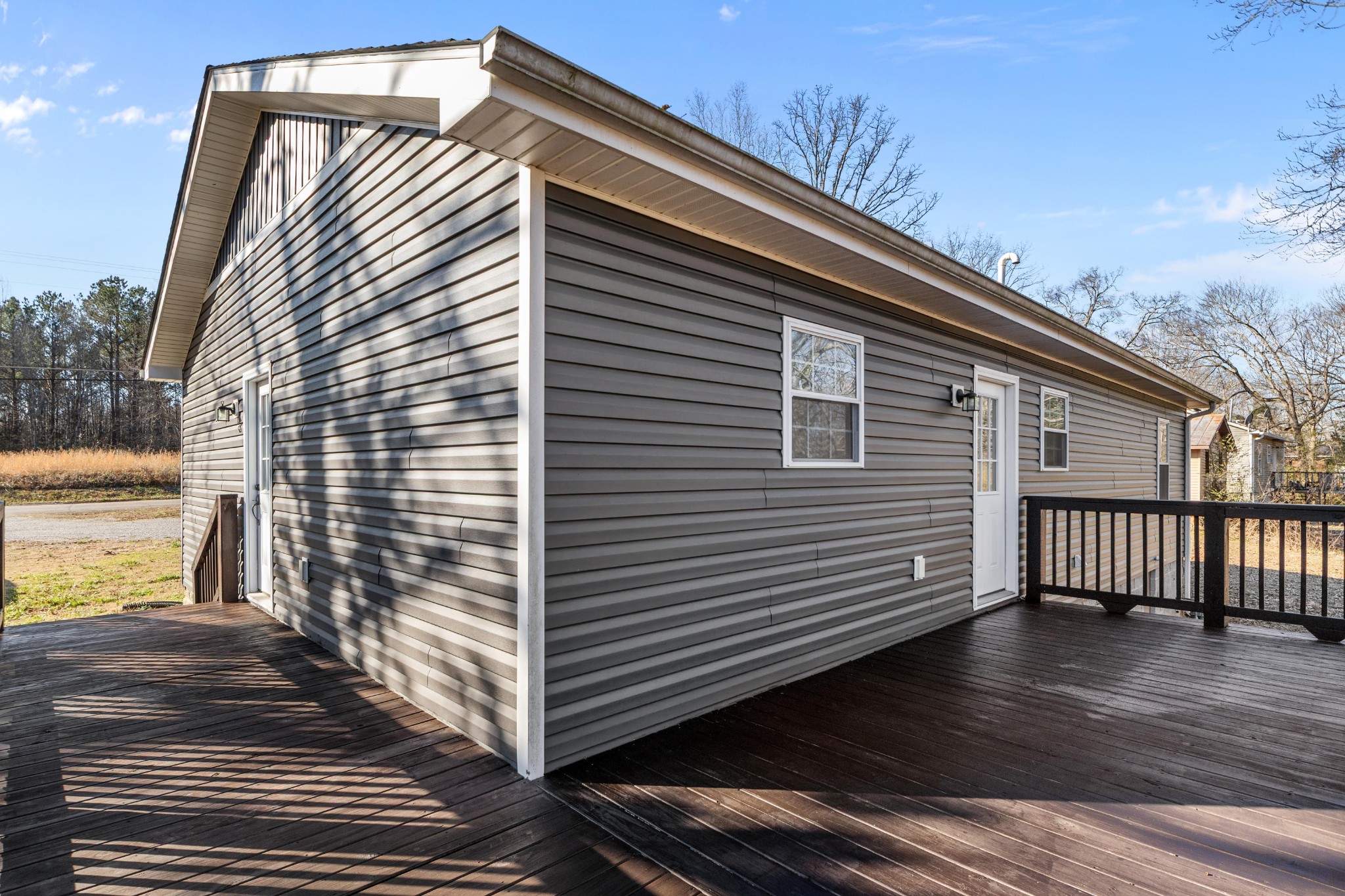 358 Able Street Big Sandy, TN 38221 - Photo 11 of 31 a view of a house with a deck