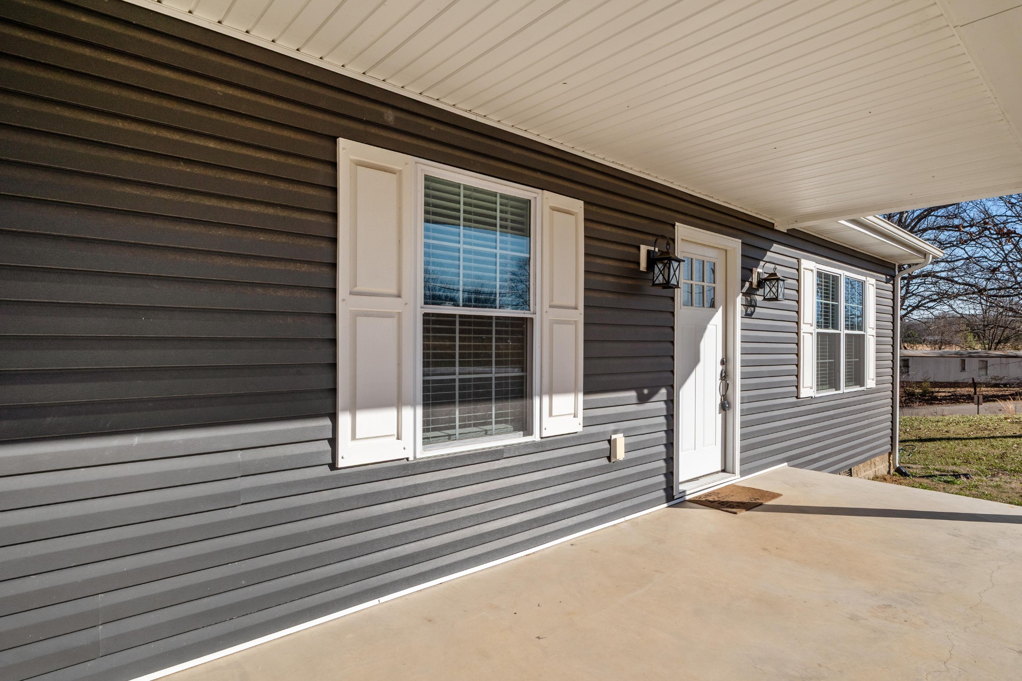 358 Able Street Big Sandy, TN 38221 - Photo 2 of 31 a front view of a house with a garage