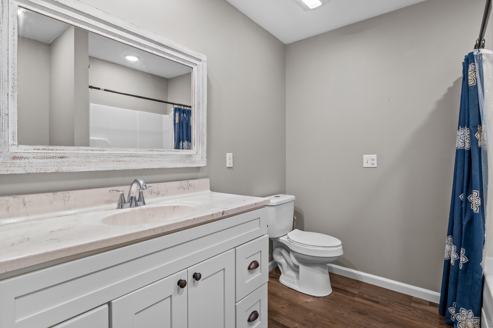 358 Able Street Big Sandy, TN 38221 - Photo 23 of 31 a bathroom with a sink a toilet and a mirror